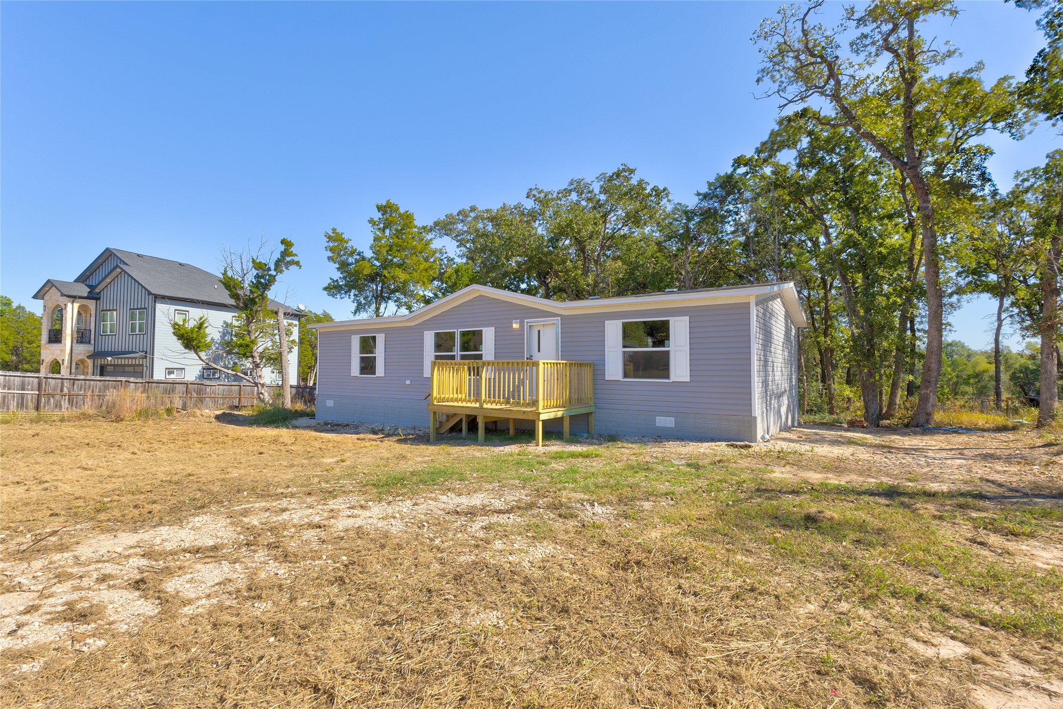 107 Los Cueva Road Elgin, TX 78621 - Photo 9 of 31 Back of house featuring crawl space and a deck