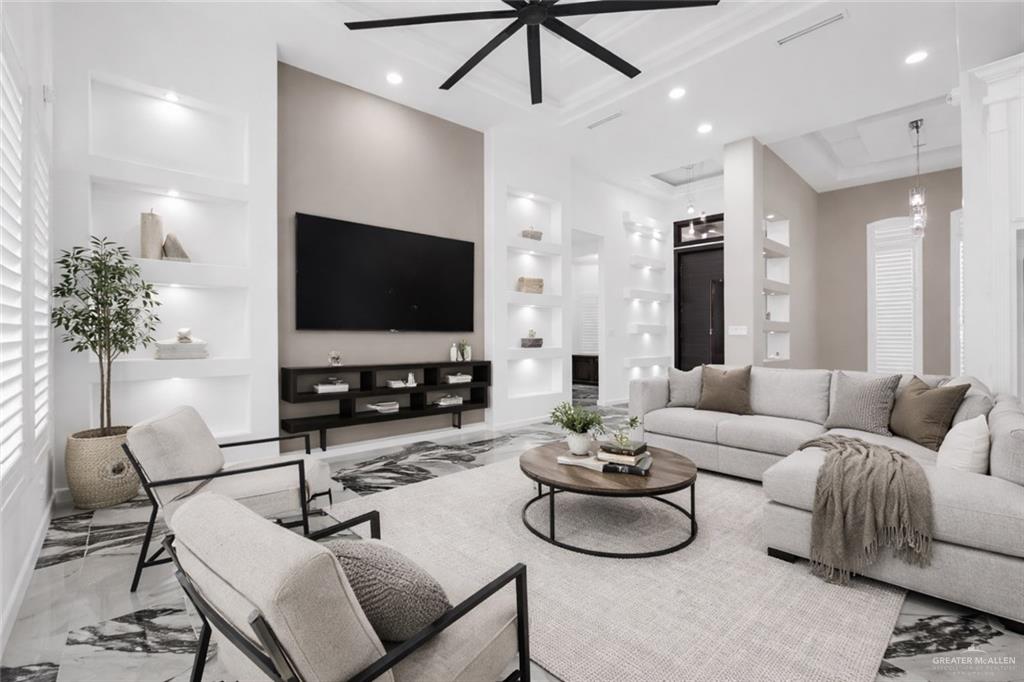 1315 Thompson Road Mission, TX 78573 - Photo 14 of 38 Living room with built in shelves, ceiling fan, and recessed lighting