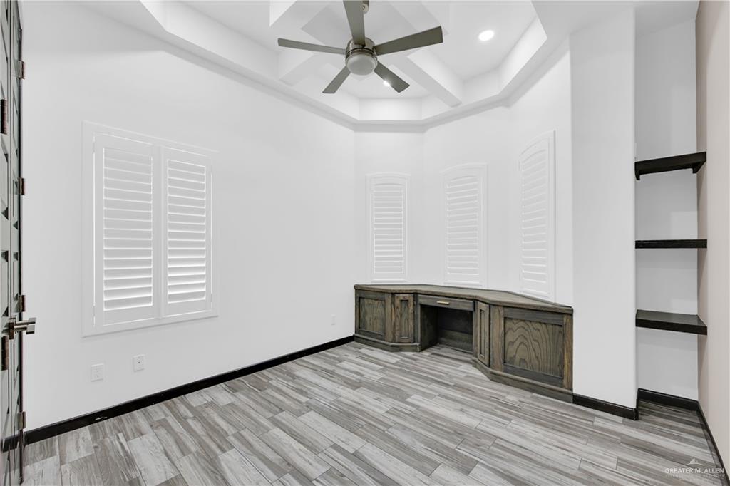 1315 Thompson Road Mission, TX 78573 - Photo 24 of 38 Unfurnished office with coffered ceiling, light wood-style flooring, ceiling fan, beamed ceiling, and recessed lighting