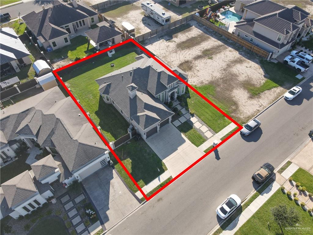 1315 Thompson Road Mission, TX 78573 - Photo 31 of 38 Aerial view of residential area featuring property parcel outlined