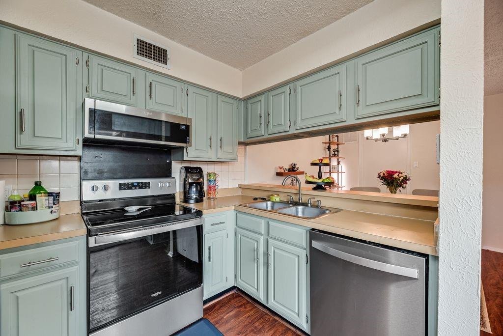 4273 Madera Road, Unit 4 Irving, TX 75038 - Photo 3 of 18 Painted kitchen cabinets and new appliances
