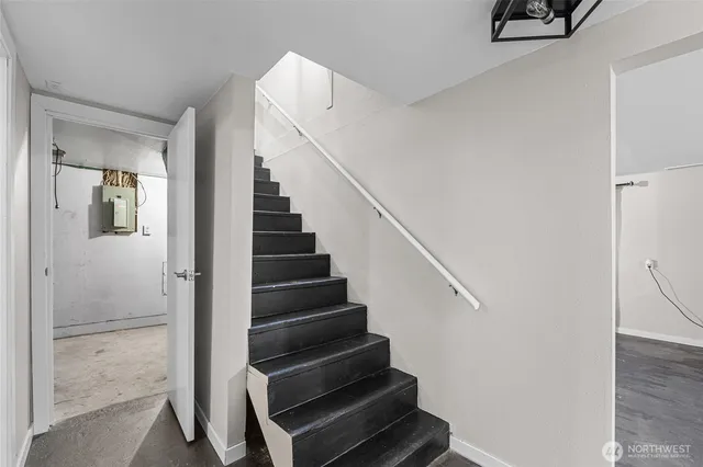 a view of entryway and hall with wooden floor
