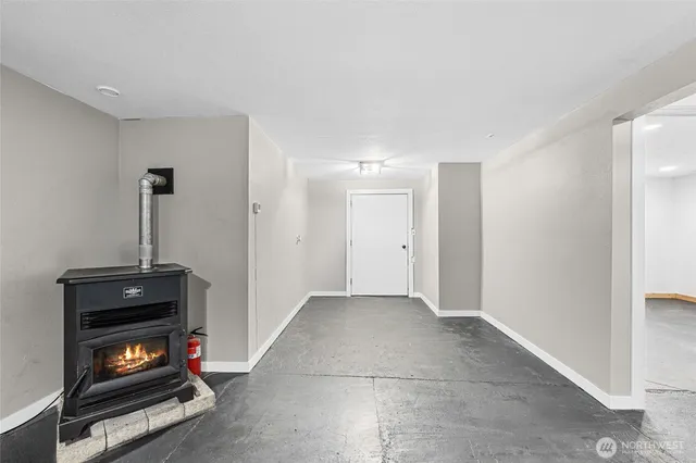 a view of an empty room with a fireplace
