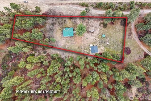 a view of a house with a yard and garage