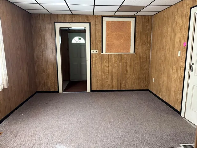 a view of an empty room with wooden door