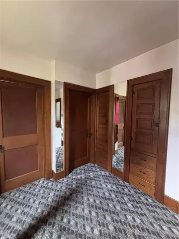 a bedroom with a bed and a closet