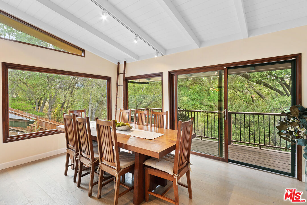 25659 Aline Way Calabasas, CA 91302 - Photo 11 of 53 a view of a dining room with furniture window and outside view