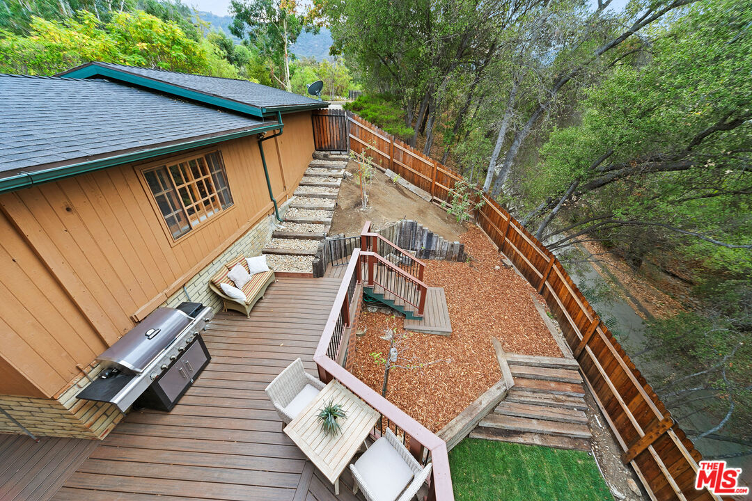 25659 Aline Way Calabasas, CA 91302 - Photo 14 of 53 a view of a wooden deck with a yard