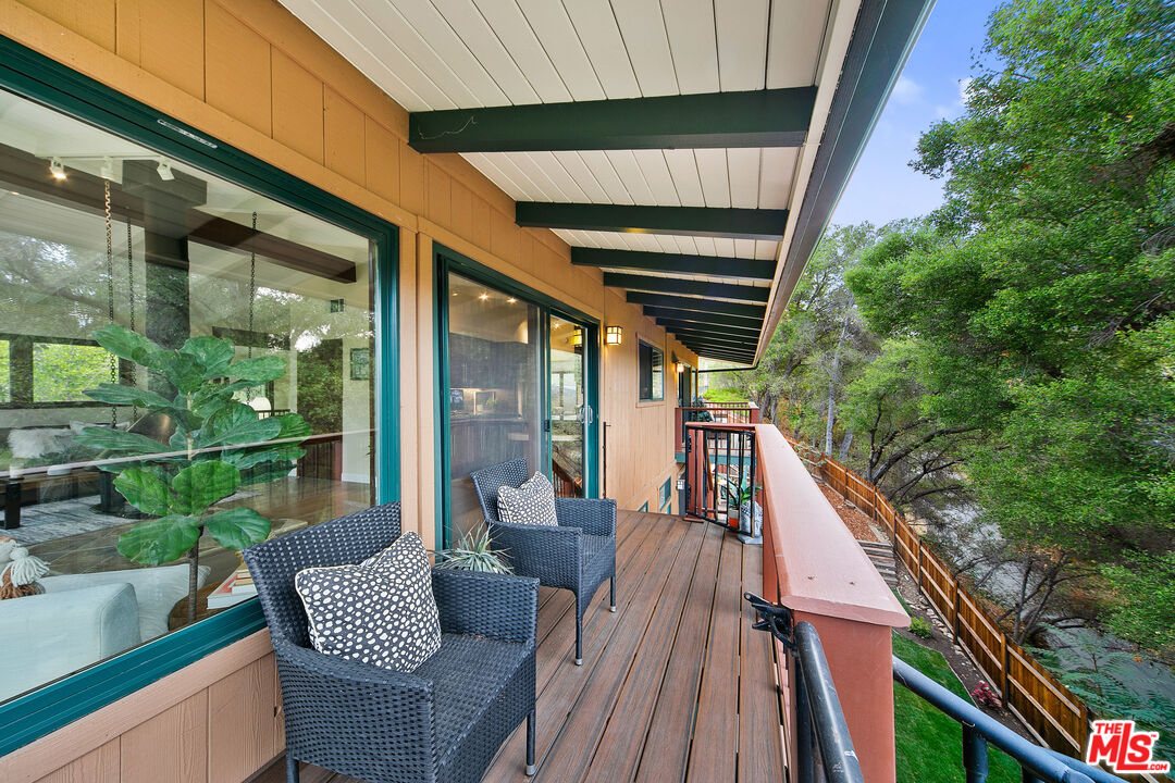 25659 Aline Way Calabasas, CA 91302 - Photo 18 of 53 a balcony view with couple of chairs and wooden floor