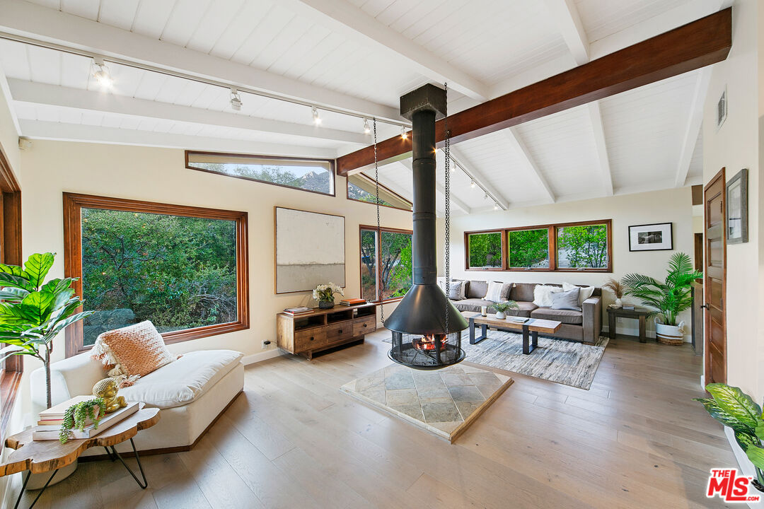 25659 Aline Way Calabasas, CA 91302 - Photo 19 of 53 a living room with furniture and a large window
