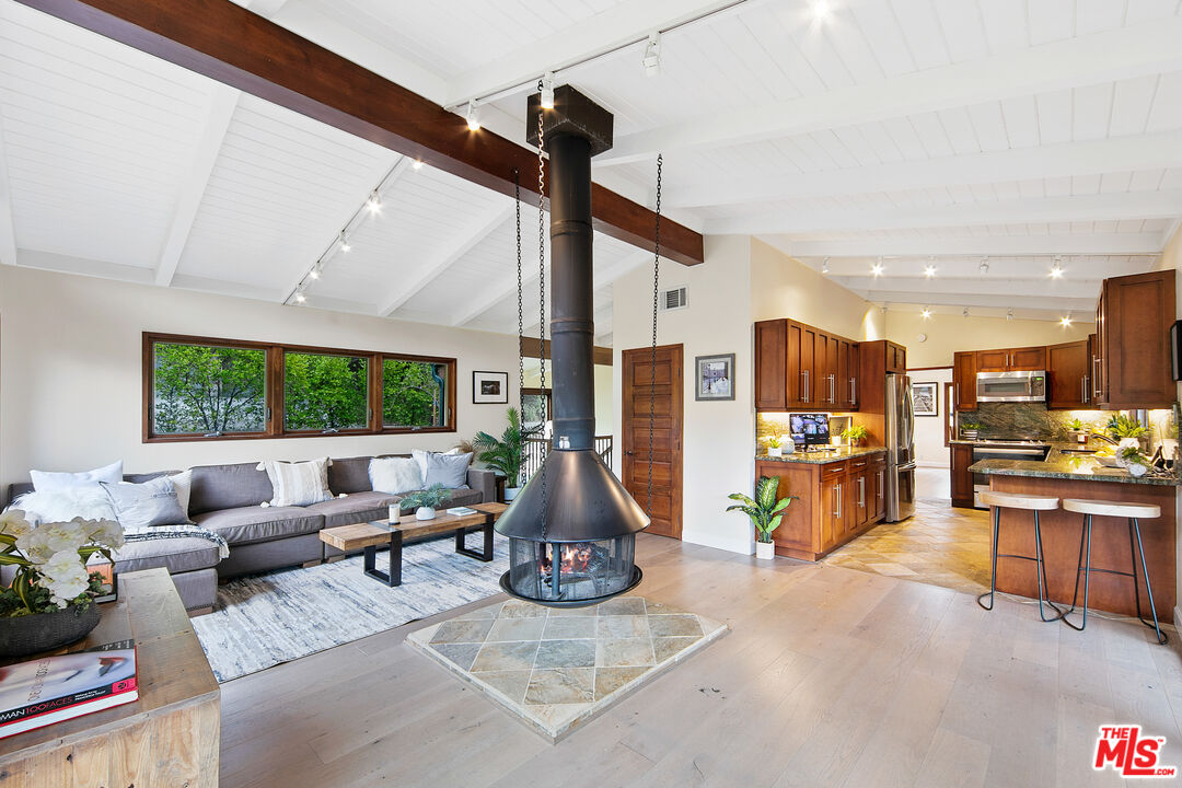 25659 Aline Way Calabasas, CA 91302 - Photo 21 of 53 a living room with furniture kitchen view and a large window