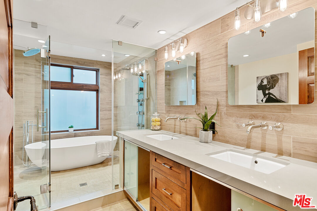 25659 Aline Way Calabasas, CA 91302 - Photo 29 of 53 a bathroom with a double vanity sink mirror and double