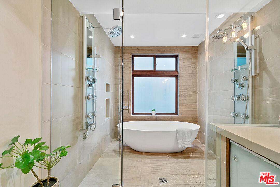 25659 Aline Way Calabasas, CA 91302 - Photo 30 of 53 a bathroom with a sink and a mirror