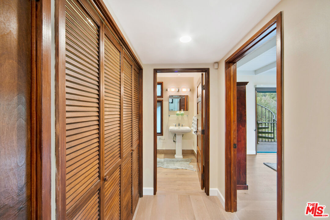25659 Aline Way Calabasas, CA 91302 - Photo 33 of 53 a view of a bathroom from a hallway