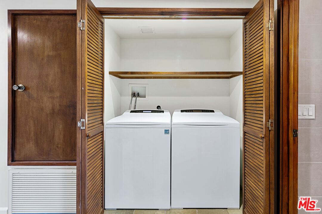 25659 Aline Way Calabasas, CA 91302 - Photo 34 of 53 a utility room with dryer and washer