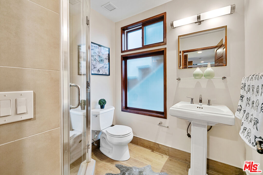 25659 Aline Way Calabasas, CA 91302 - Photo 35 of 53 a bathroom with a sink toilet and shower