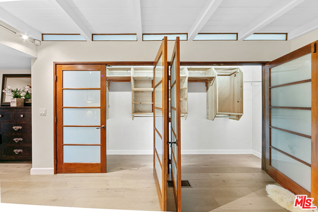 25659 Aline Way Calabasas, CA 91302 - Photo 38 of 53 a view of walk in closet with wooden floor