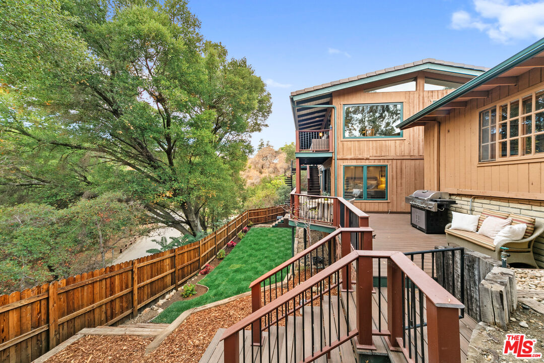 25659 Aline Way Calabasas, CA 91302 - Photo 39 of 53 a view of a house with backyard and sitting area