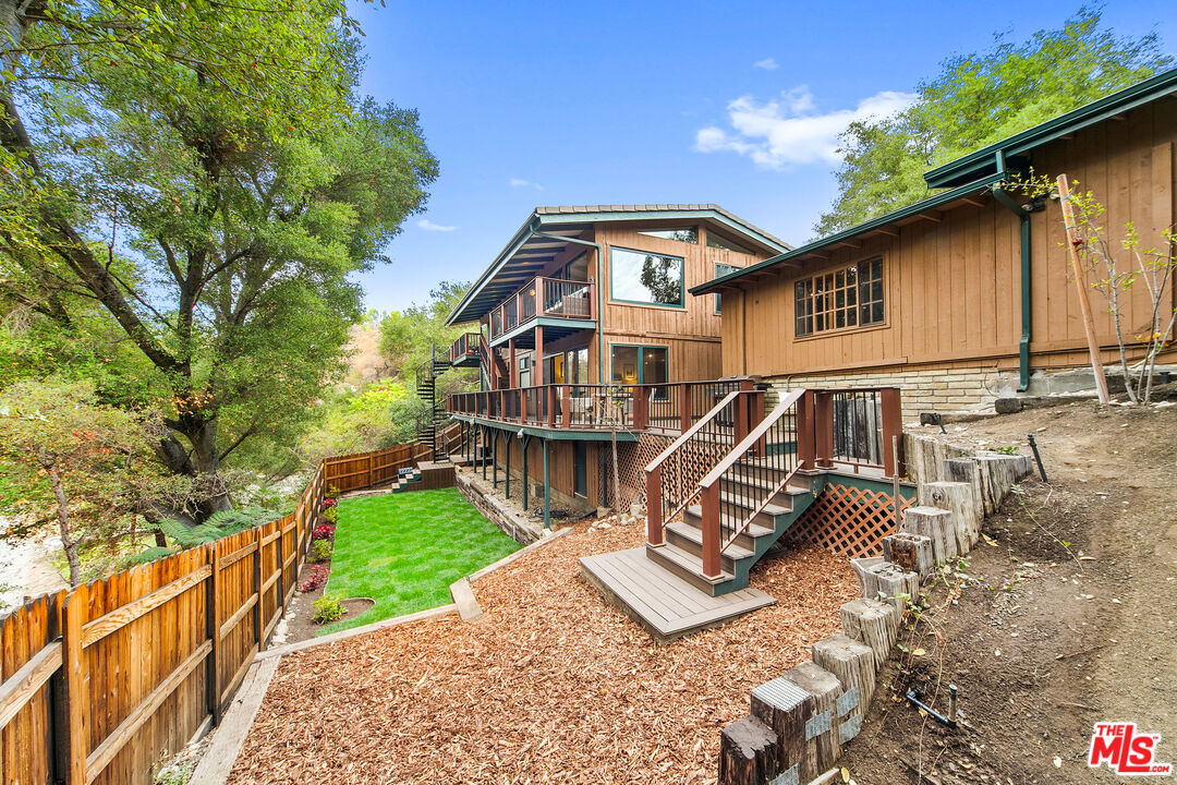 25659 Aline Way Calabasas, CA 91302 - Photo 40 of 53 a view of a house with a yard