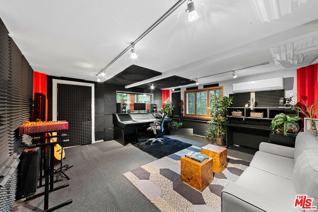 25659 Aline Way Calabasas, CA 91302 - Photo 42 of 53 a living room with furniture a rug and a fireplace