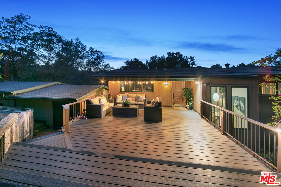 25659 Aline Way Calabasas, CA 91302 - Photo 47 of 53 a view of a roof deck with dining table and chairs