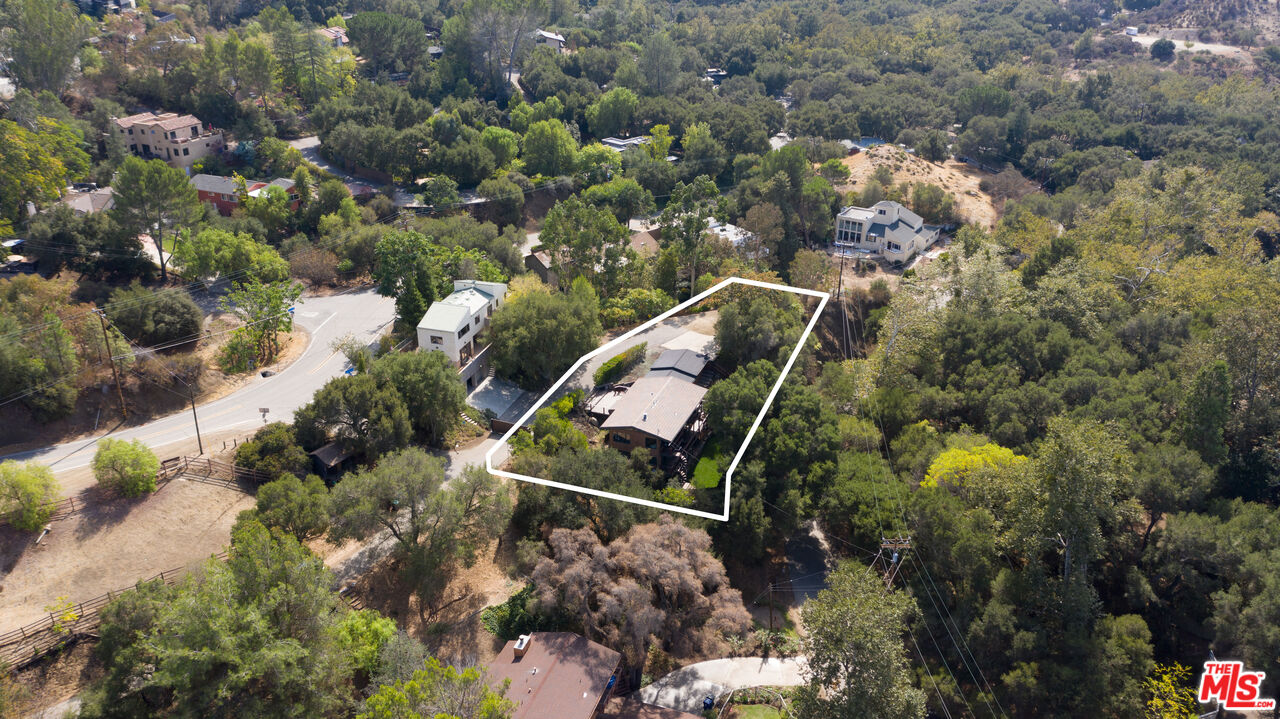 25659 Aline Way Calabasas, CA 91302 - Photo 53 of 53 an aerial view of a house with a yard and lake