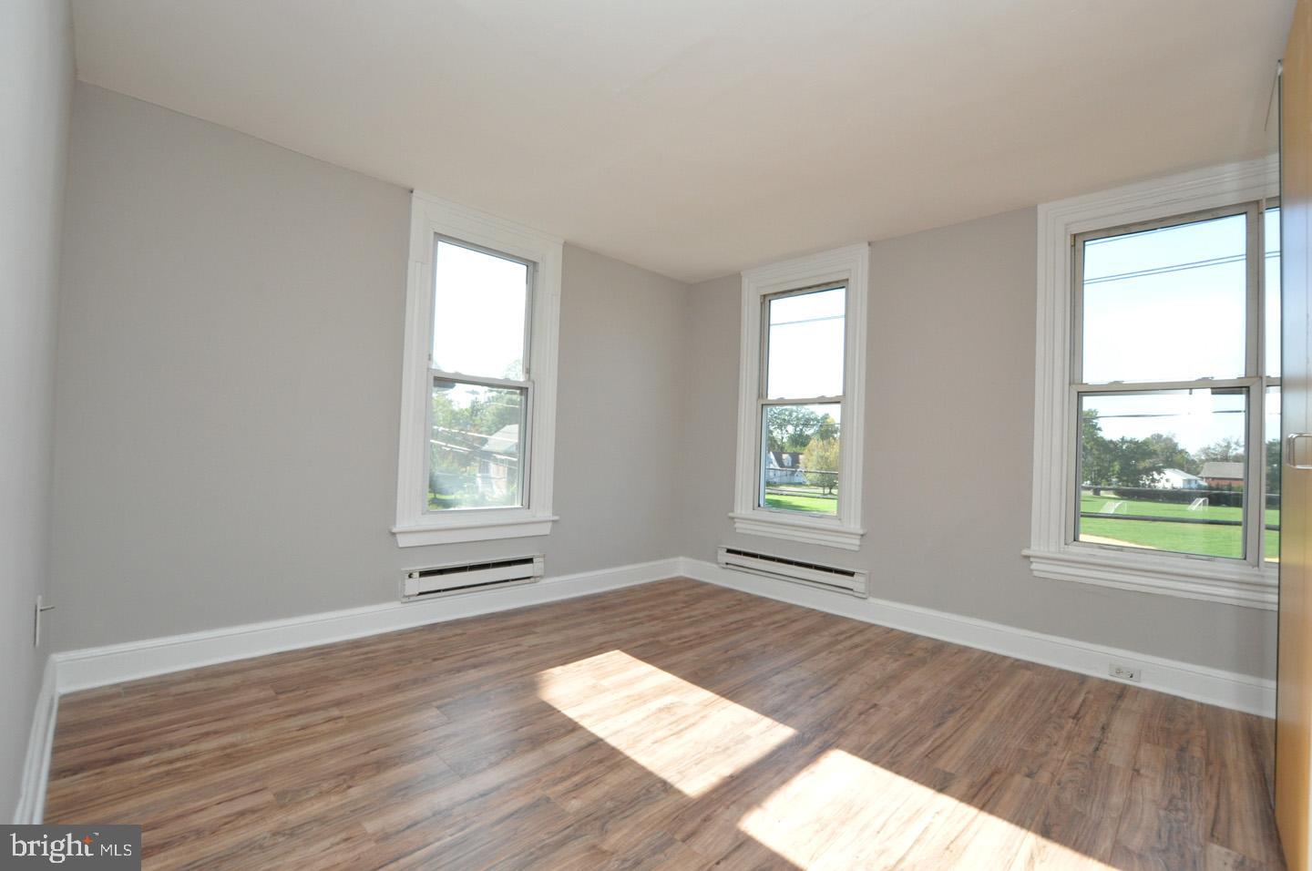20 New Albany Road Moorestown, NJ 08057 - Photo 14 of 25 a view of an empty room with wooden floor and a window