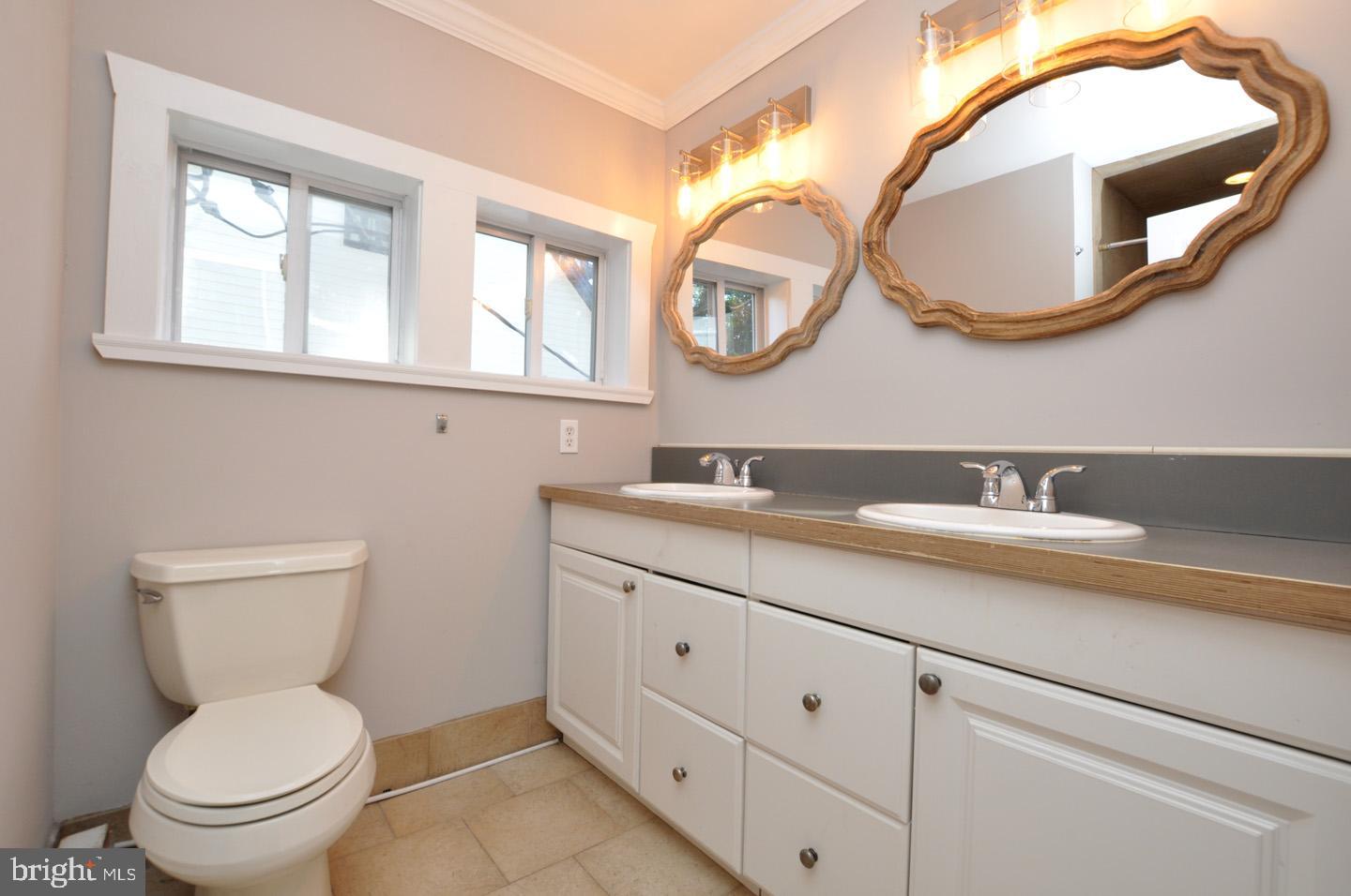 20 New Albany Road Moorestown, NJ 08057 - Photo 16 of 25 a bathroom with a toilet a sink and a mirror