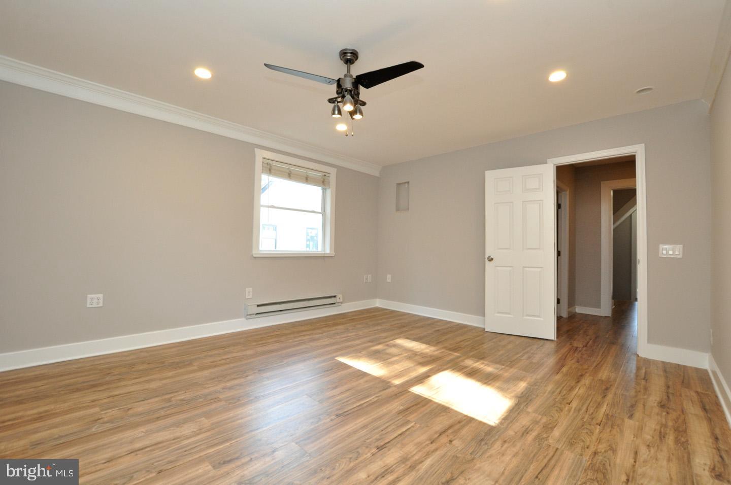 20 New Albany Road Moorestown, NJ 08057 - Photo 20 of 25 a view of empty room with wooden floor and fan
