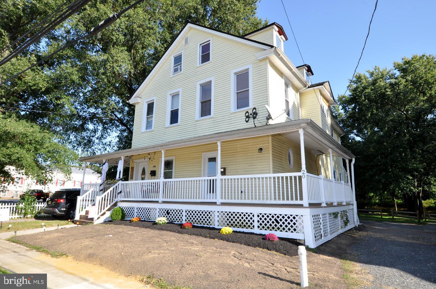 20 New Albany Road Moorestown, NJ 08057 - Photo 2 of 25 a view of a white house with iron fence