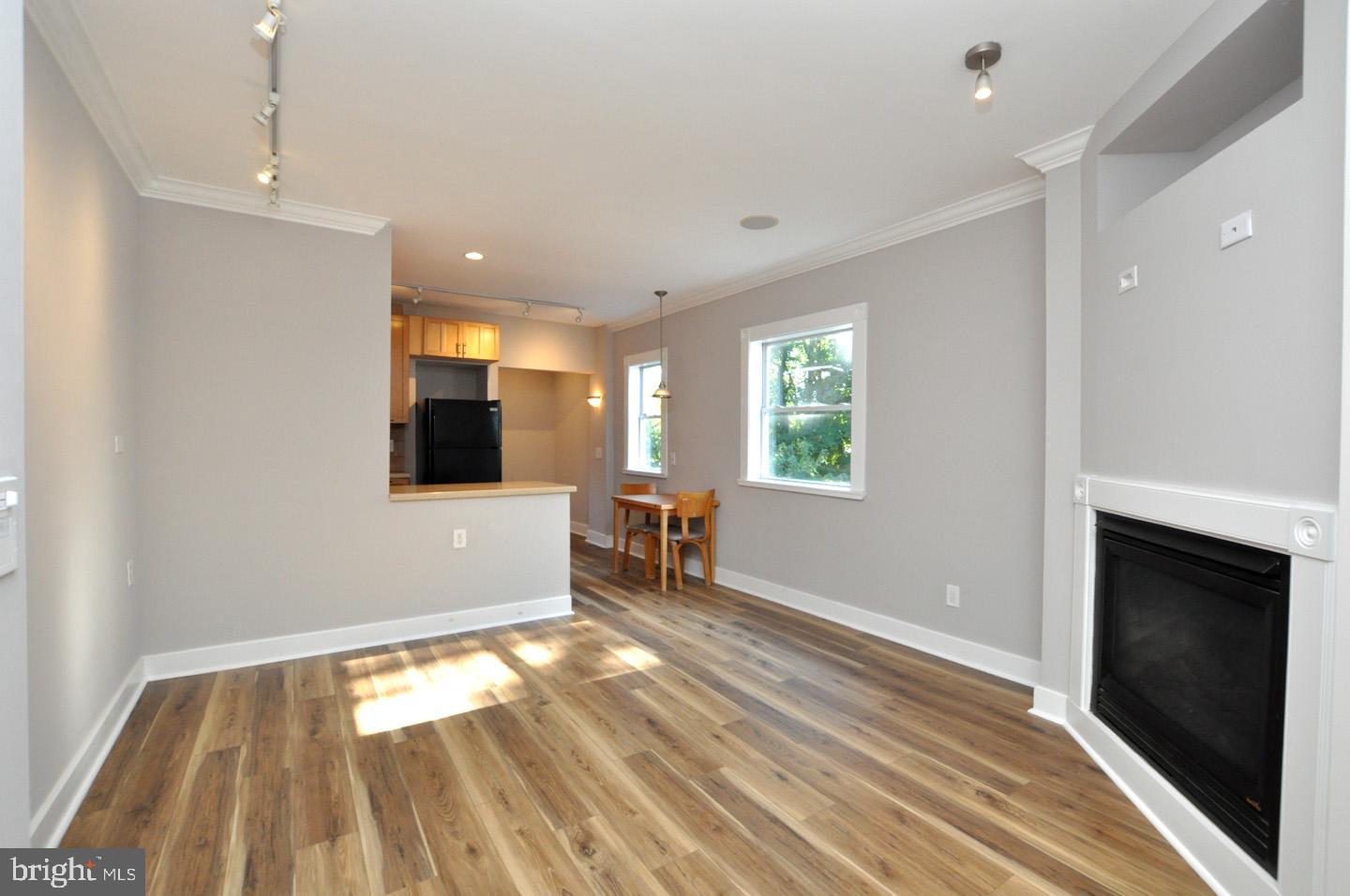 20 New Albany Road Moorestown, NJ 08057 - Photo 9 of 25 a view of an empty room with window and wooden floor
