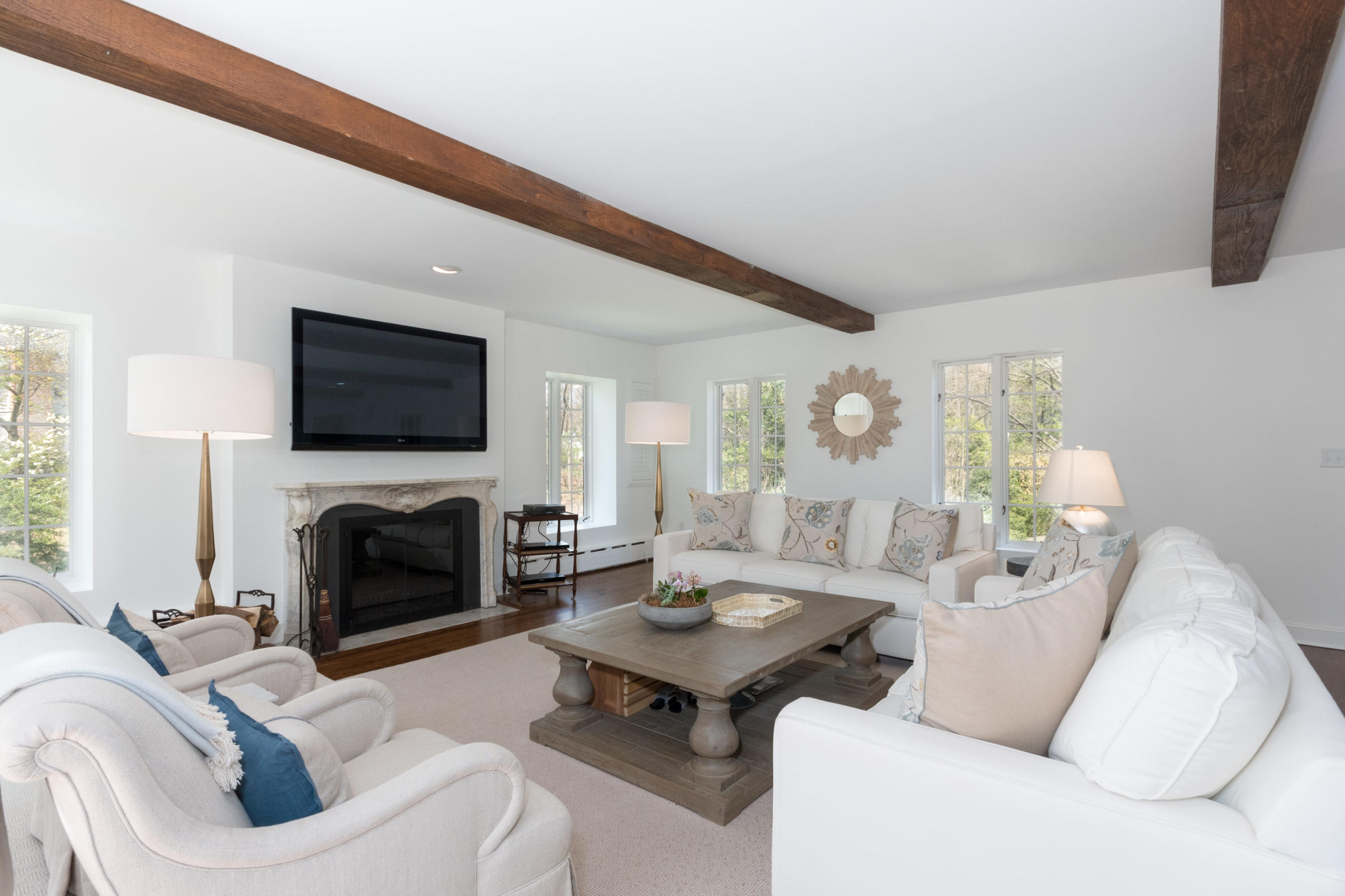 170 Ridge Acres Road Darien, CT 06820 - Photo 11 of 50 a living room with furniture a fireplace and a flat screen tv