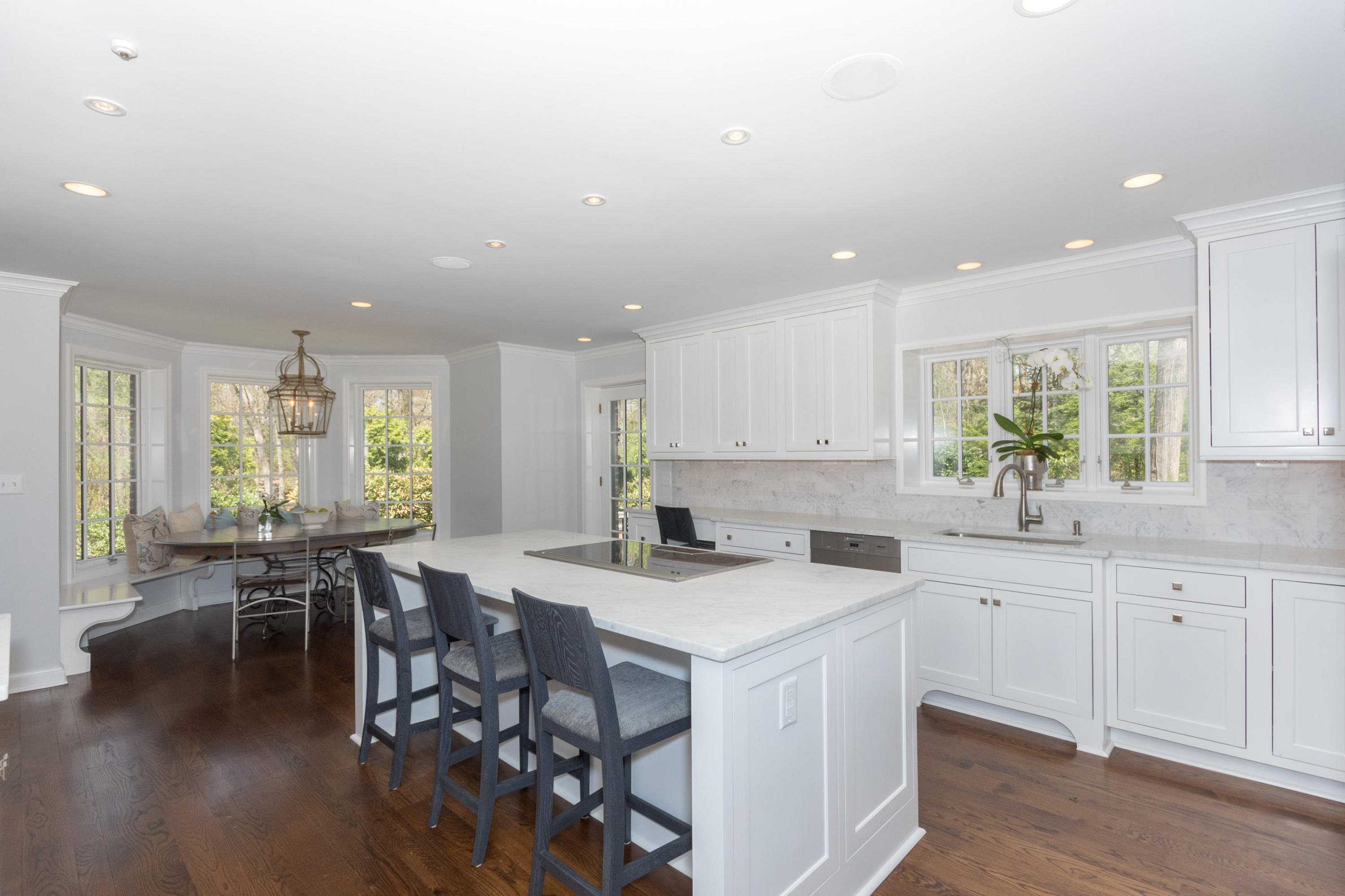 170 Ridge Acres Road Darien, CT 06820 - Photo 12 of 50 a kitchen with lots of counter top space and furniture