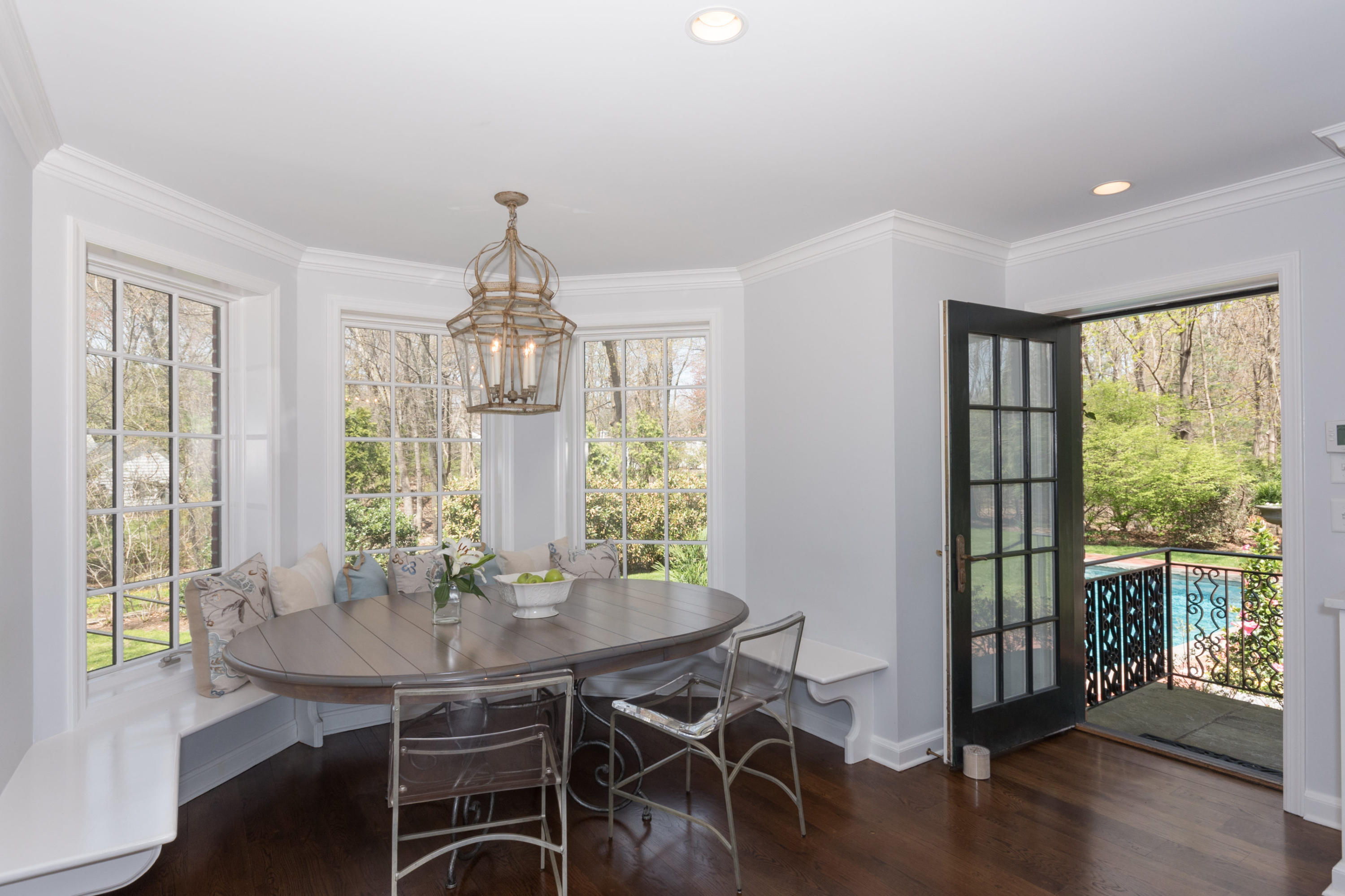 170 Ridge Acres Road Darien, CT 06820 - Photo 14 of 50 a view of a dining room with furniture window and wooden floor