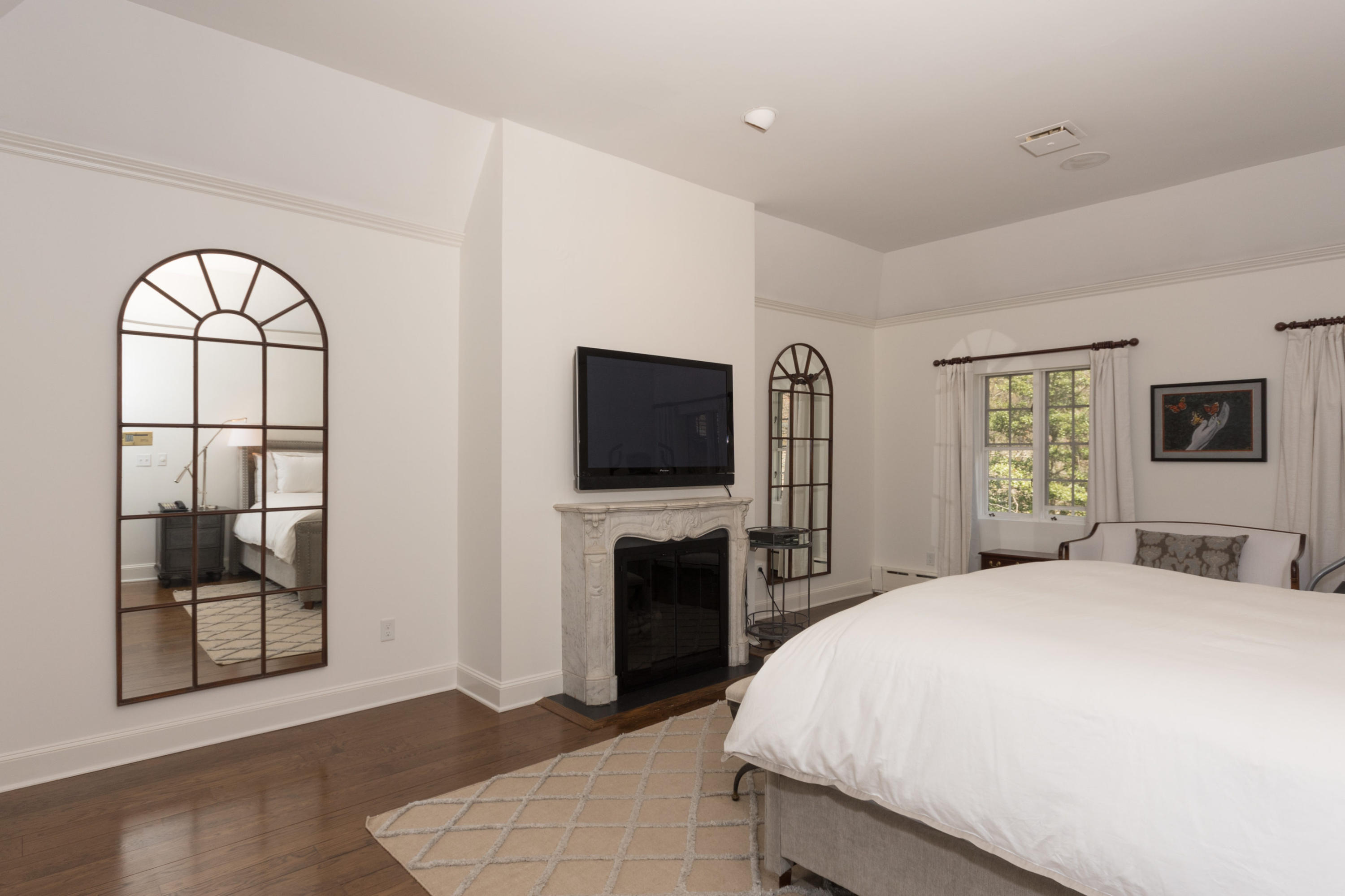 170 Ridge Acres Road Darien, CT 06820 - Photo 19 of 50 a bedroom with a bed and a flat screen tv
