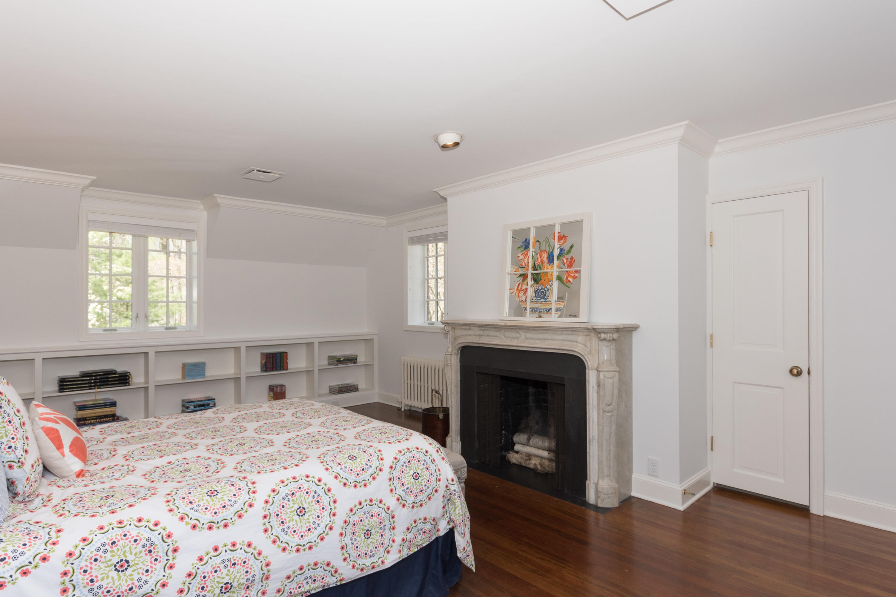 170 Ridge Acres Road Darien, CT 06820 - Photo 26 of 50 a bedroom with a bed and a fireplace