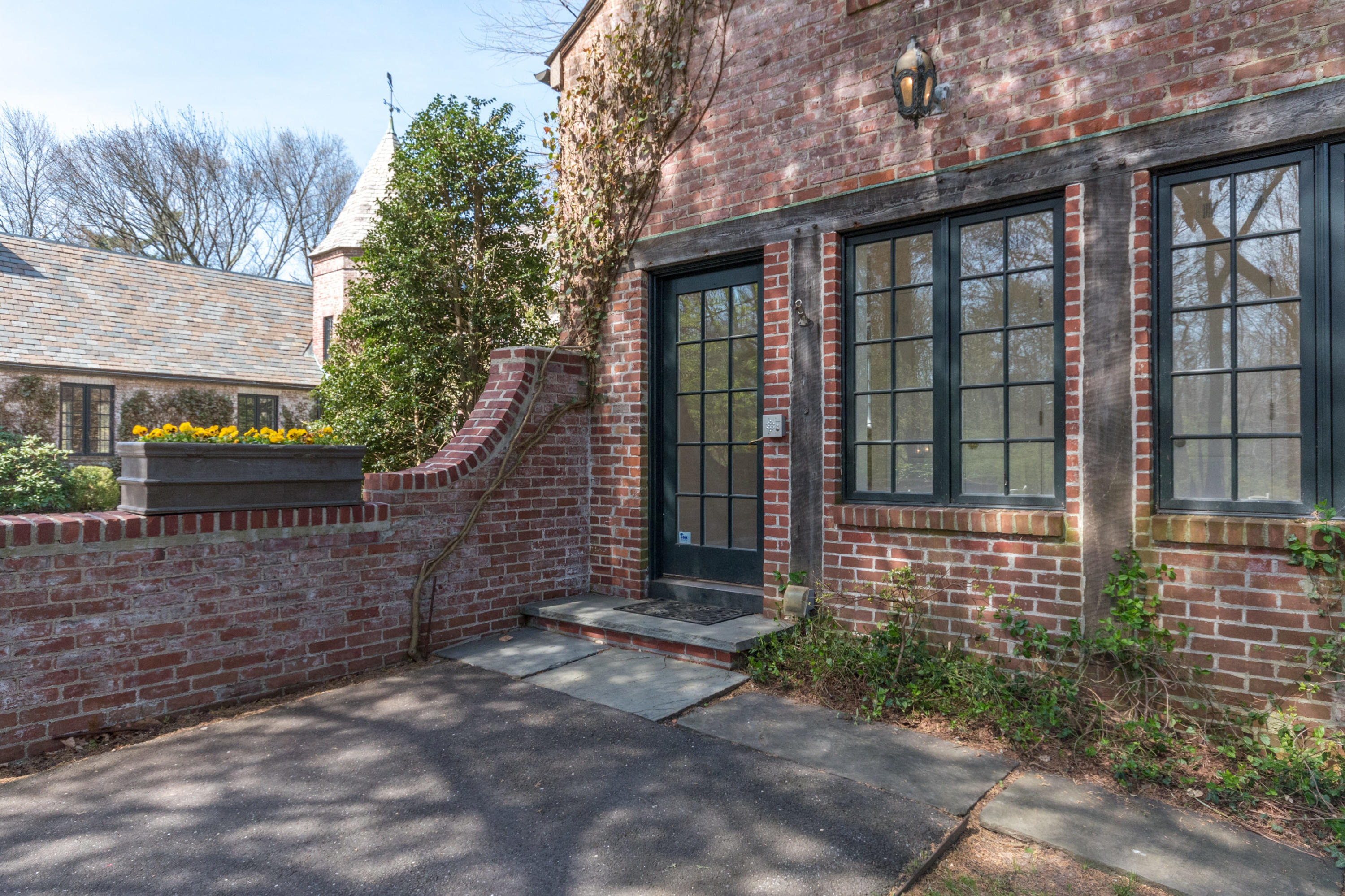 170 Ridge Acres Road Darien, CT 06820 - Photo 29 of 50 a front view of a house with a garden