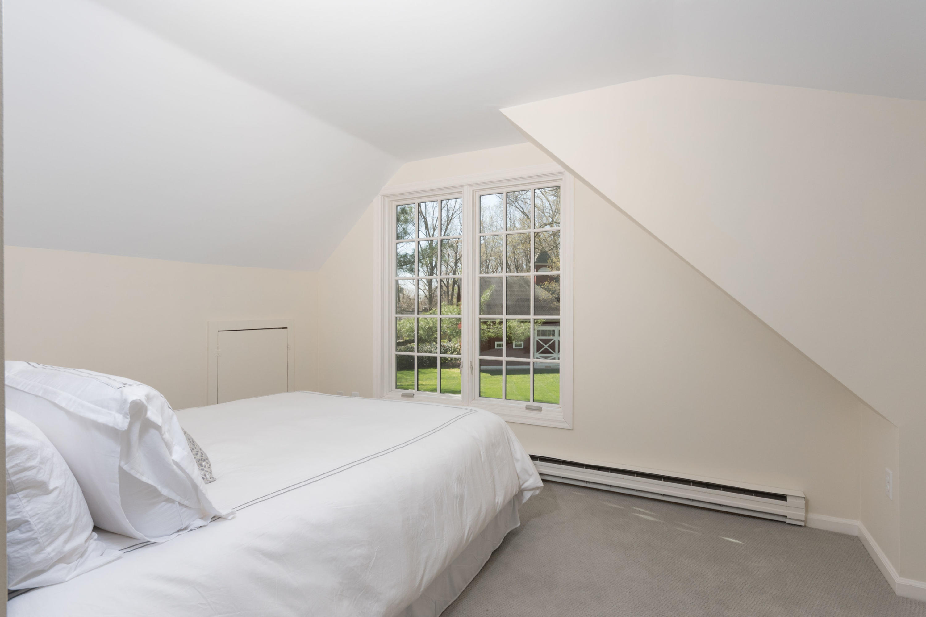 170 Ridge Acres Road Darien, CT 06820 - Photo 30 of 50 a bedroom with a bed and a window