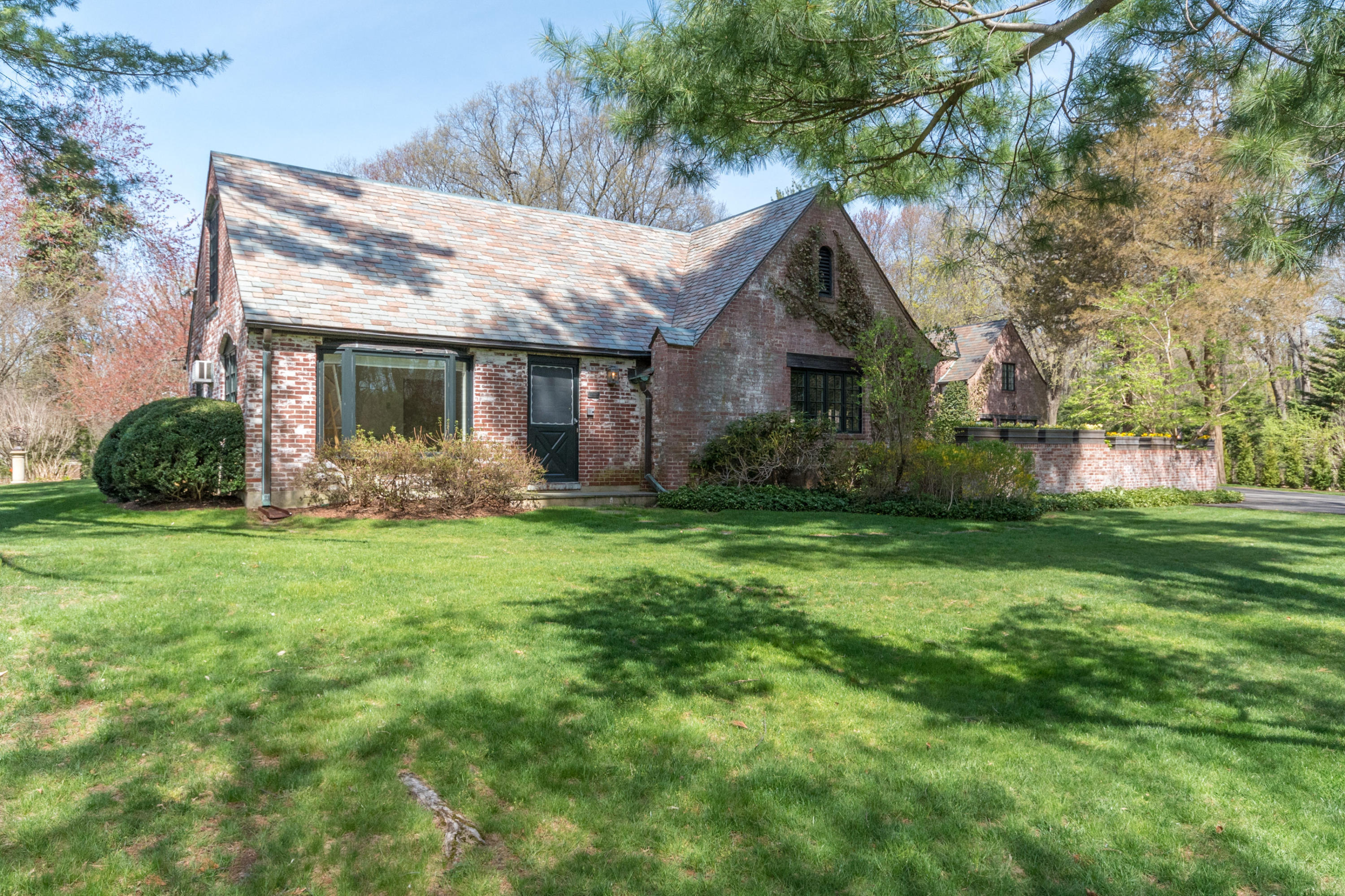170 Ridge Acres Road Darien, CT 06820 - Photo 33 of 50 a front view of house with yard and green space