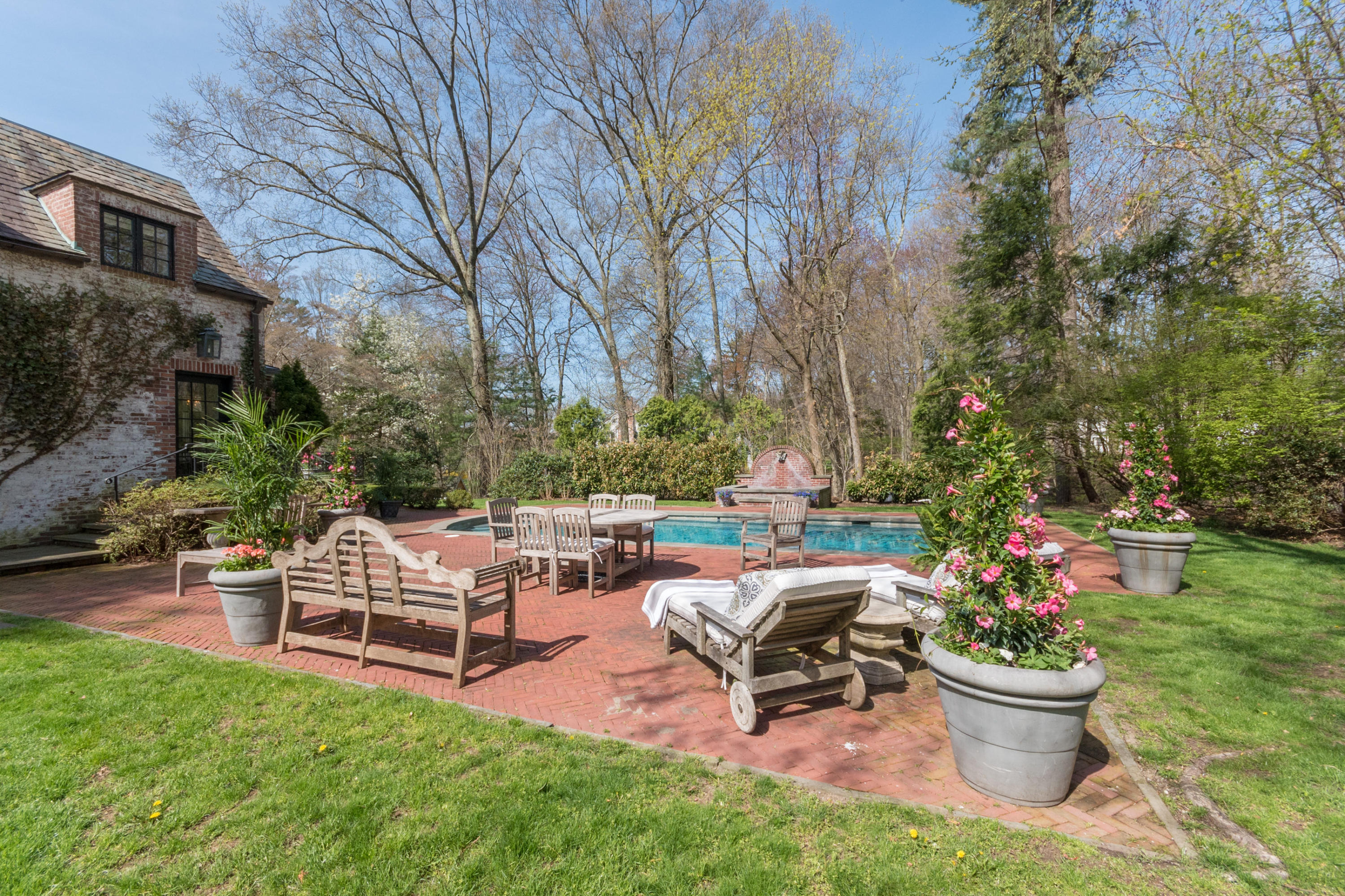 170 Ridge Acres Road Darien, CT 06820 - Photo 38 of 50 a view of a backyard with sitting area and garden