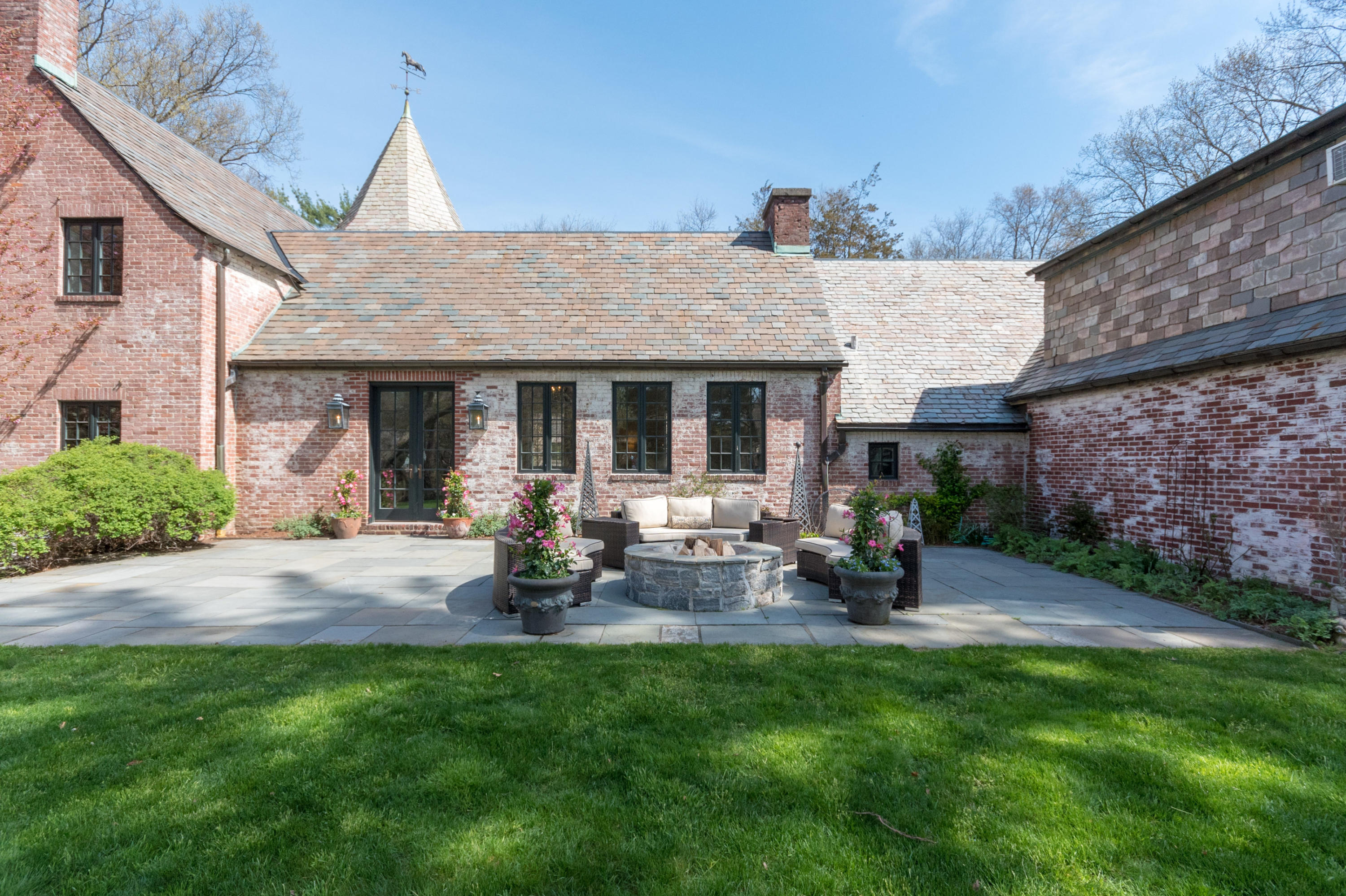 170 Ridge Acres Road Darien, CT 06820 - Photo 43 of 50 a front view of a house with sitting area and garden