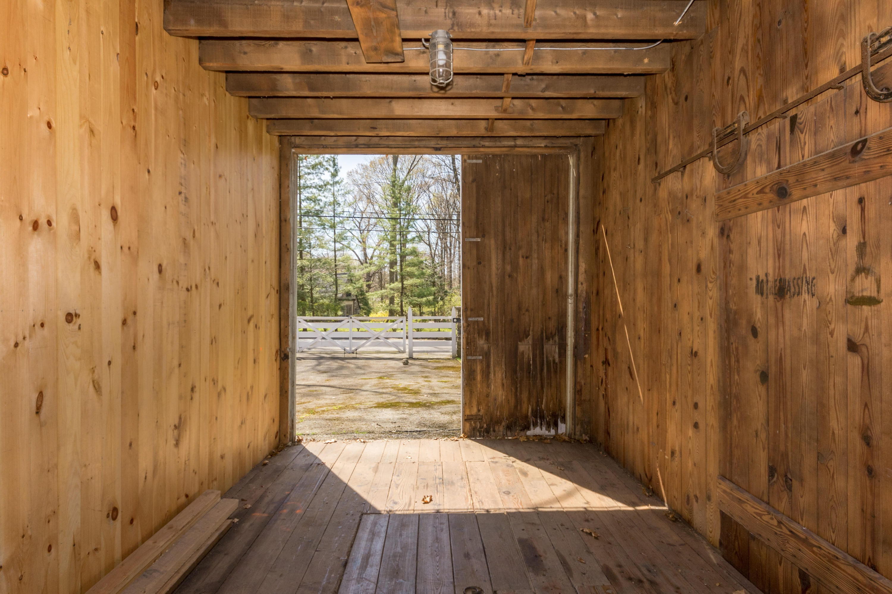 170 Ridge Acres Road Darien, CT 06820 - Photo 47 of 50 a view of empty room with wooden floor and fan