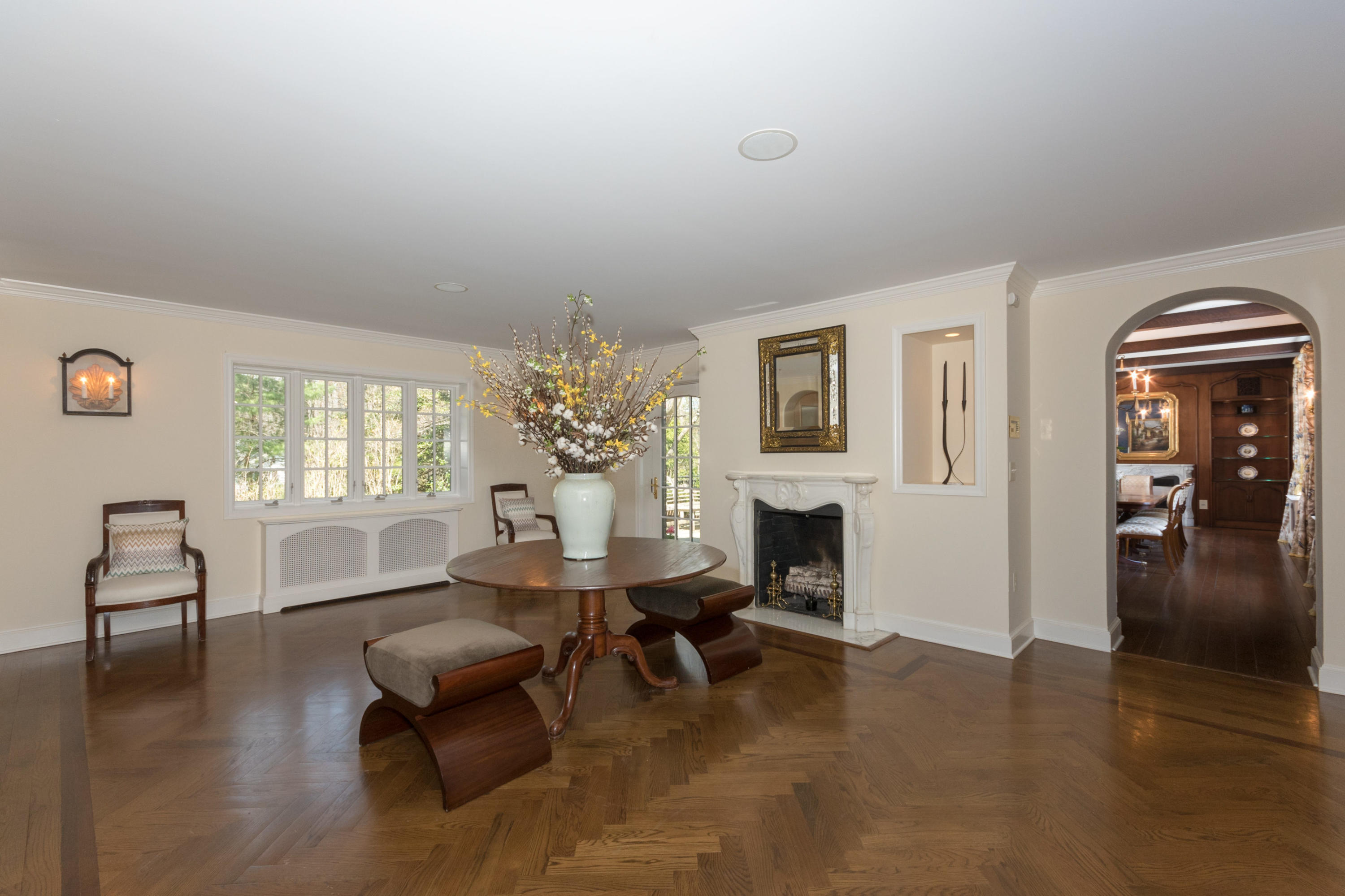 170 Ridge Acres Road Darien, CT 06820 - Photo 6 of 50 a living room with furniture a dining table and a fireplace