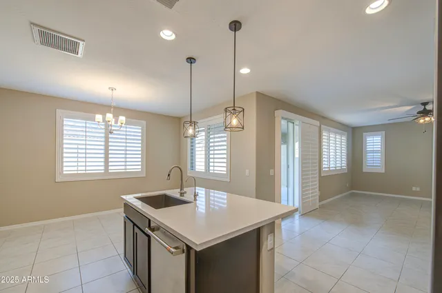 a large kitchen with a cabinets and stainless steel appliances