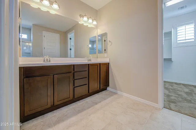 a bathroom with a toilet a sink and shower