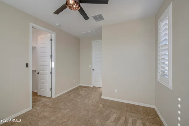 a view of an outdoor dining space with a table and chairs