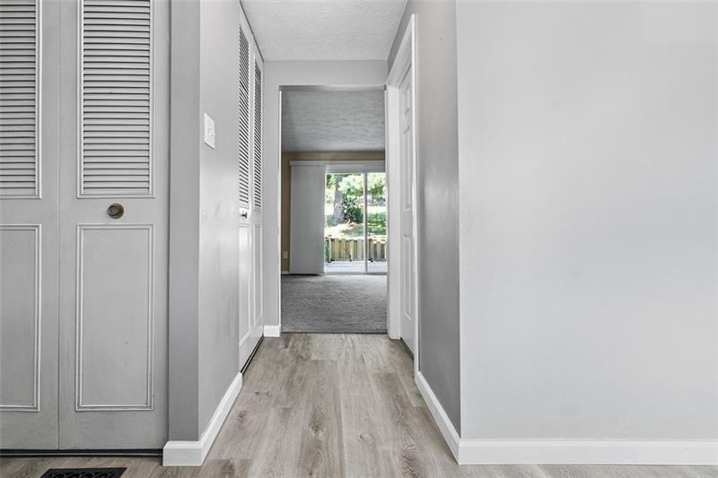 624 Deer Watch Road Bridgeville, PA 15017 - Photo 3 of 7 a view of a hallway with wooden floor and a bathroom