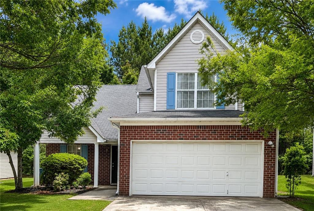 6936 Red Bone Way Stonecrest, GA 30038 - Photo 1 of 17 a front view of a house with a yard