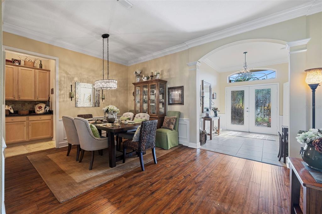 25745 Unbridled Court Wesley Chapel, FL 33544 - Photo 19 of 64 a view of a dining room with furniture window and wooden floor