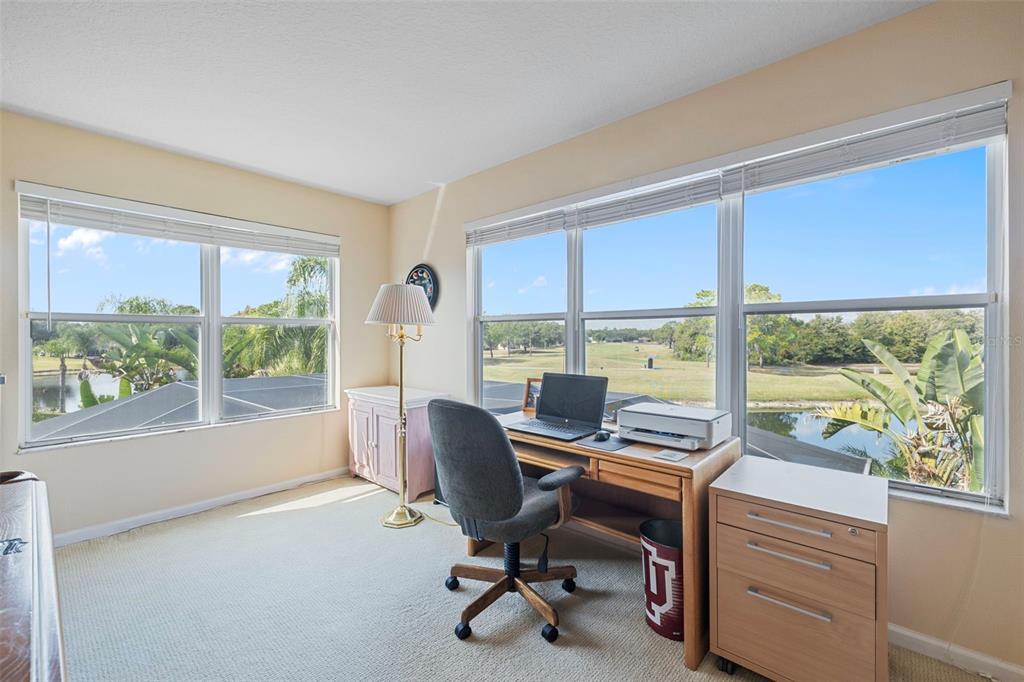 25745 Unbridled Court Wesley Chapel, FL 33544 - Photo 41 of 64 a view of a workspace with furniture and a window